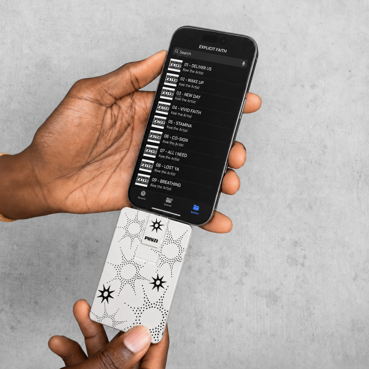 Phyzi card plugged into an iPhone playing the album